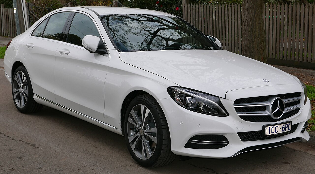 White Mercedes-Benz C 200 sedan, front three-quarter view